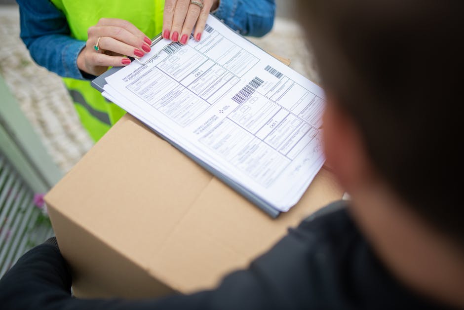 Courier hands over a package for delivery with signing of receipt documents